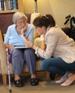 Bella Hardy reading to elderly lady