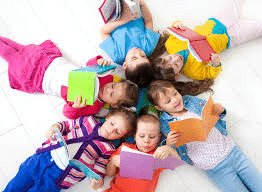 kids reading lying in a circle