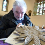 man displaying clay flower