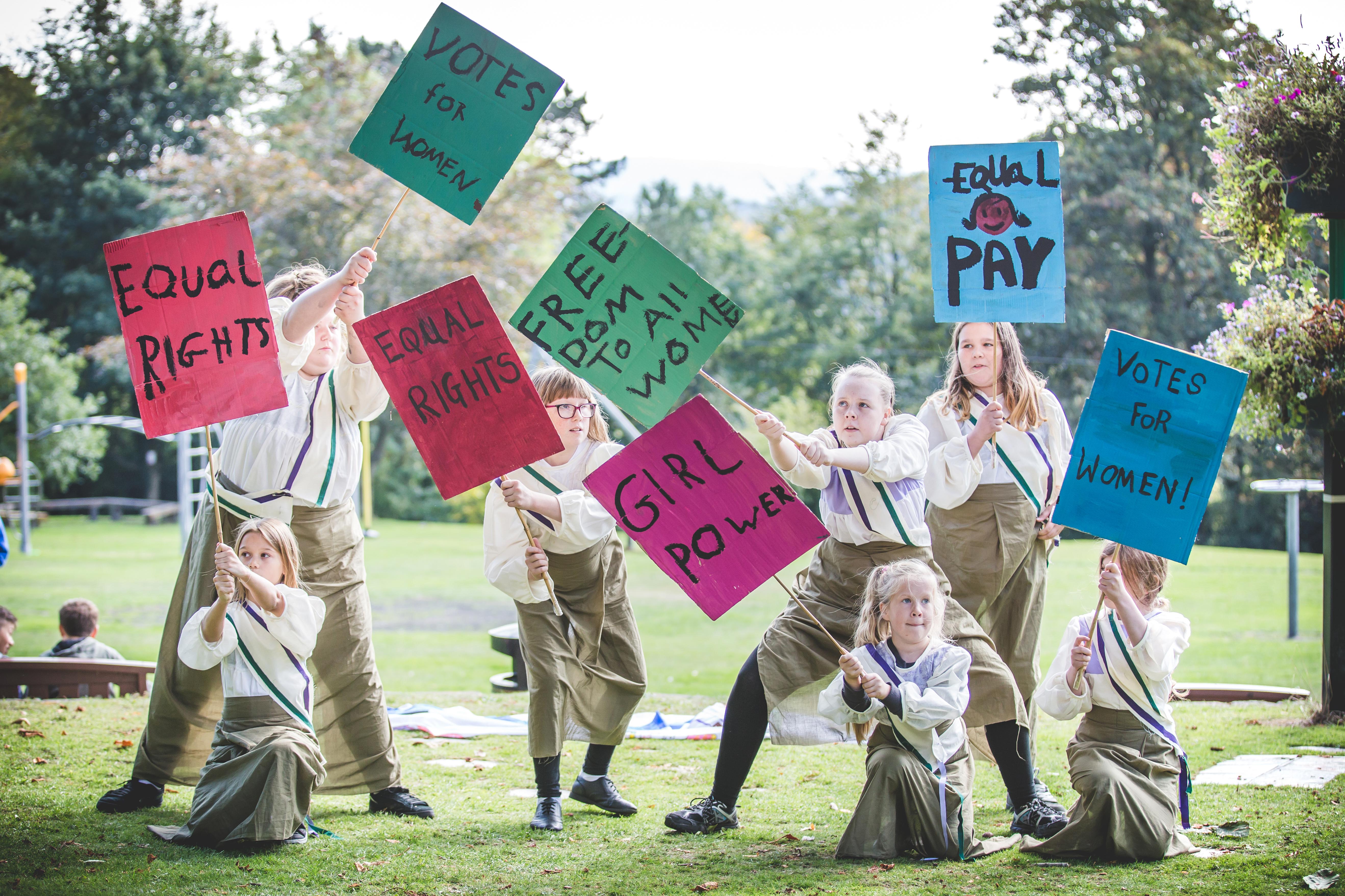 Votes for women girls with banners