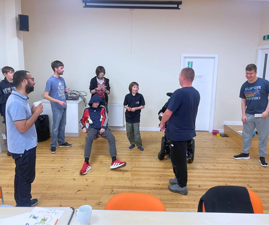 Film Cuts Club group gathered around to take part in an icebreaker game.