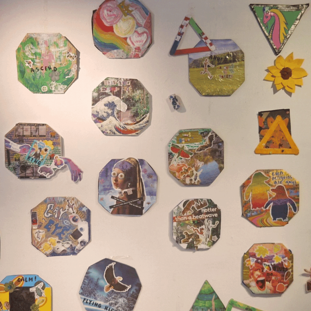 A wall filled with octagon shaped collages, all brightly coloured.
